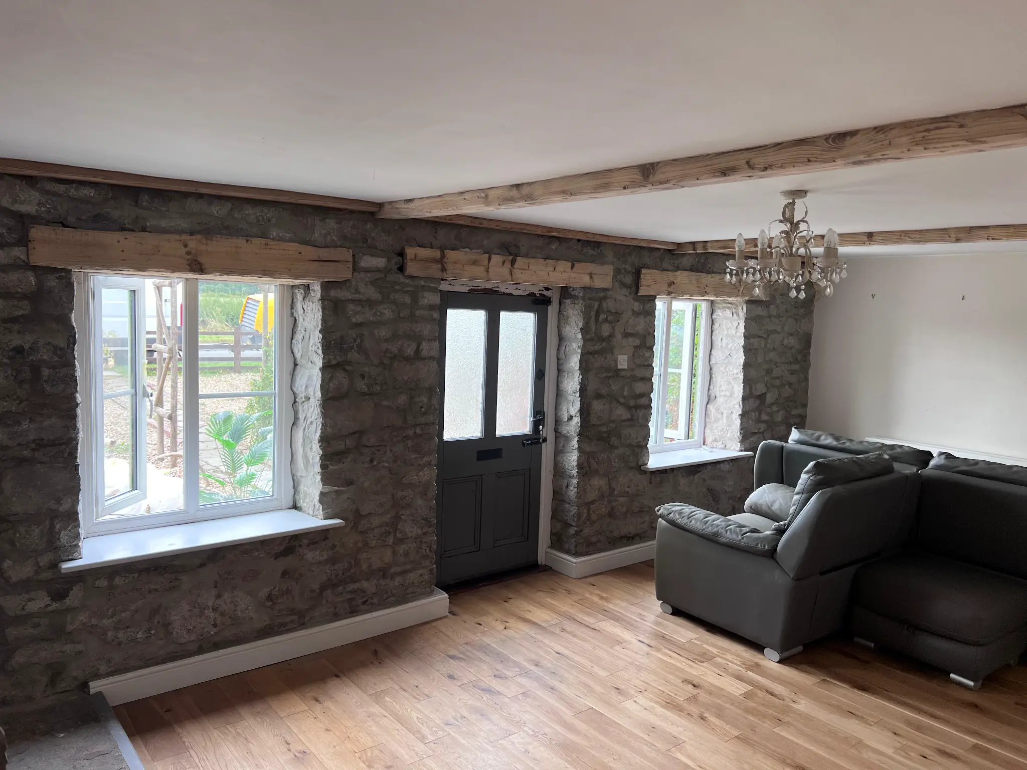 Character interior with lighter exposed ceiling beams after restoration